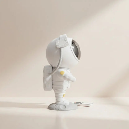 White astronaut light projector with a beige background